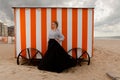 Girl sun sand hut, De Panne, Belgium Royalty Free Stock Photo