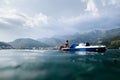 Girl sunbathe in sea on paddle boat catamaran Royalty Free Stock Photo