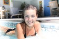 girl, sunbathe in the swimming pool in a black swimsuit Royalty Free Stock Photo