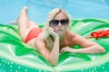 Girl sunbathing on inflatable Royalty Free Stock Photo