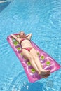 Girl sunbathing on a mattress