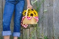 Girl with sunflower basket