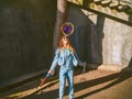 Girl in sunglasses and a big soap bubble near her face