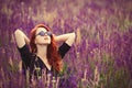 Girl with sunglasses on lavender field. Royalty Free Stock Photo