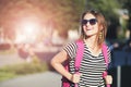 Girl In Sunglasses Smiling And Walking