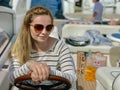 Girl in sunglasses travels on a yacht