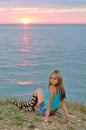 A girl at sunset on the beach Royalty Free Stock Photo