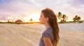 Girl at sunset caribbean beach in Mexico