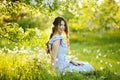 Girl at sunset in a flowering garden