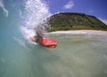 Girl Surfing a Big Wave in Hawaii Royalty Free Stock Photo