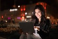 Girl surfing internet and checking social networks in the city Royalty Free Stock Photo
