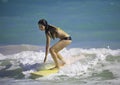 Girl surfing at Kailua Beach