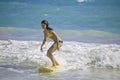 Girl surfing at Kailua Beach