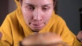 Girl in a sweat runs on an ellipsoid and stimulates herself with a juicy burger