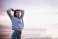 Girl in a sweater near the sea Royalty Free Stock Photo