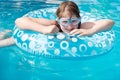 Girl in swim goggle on inflatable circle Royalty Free Stock Photo