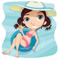 Girl with swim ring in swimming pool.