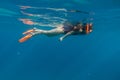 Girl in swimming mask and flippers dive in Red sea Royalty Free Stock Photo