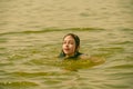 A girl swims in the river. Close up of young beautiful girl in water Royalty Free Stock Photo