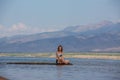 Girl in a swimsuit on lake