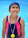Girl in swimsuit with medals