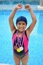 Girl in swimsuit with medals