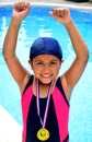 Girl in swimsuit with medals