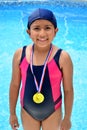 Girl in swimsuit with medals