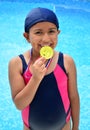 Girl in swimsuit with medals