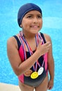 Girl in swimsuit with medals