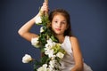 Girl swing flowers alone on grey background Royalty Free Stock Photo