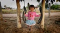 Girl on a swing, Isaan, North East Thailand