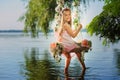 Girl on swing over river Royalty Free Stock Photo