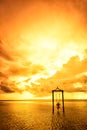 A girl on a swing over the sea at sunset in bali,indonesia 5