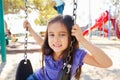 Girl On Swing In Park Royalty Free Stock Photo