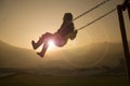 Girl on Swing at sunset Royalty Free Stock Photo