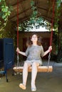 Girl on swing in yard Royalty Free Stock Photo