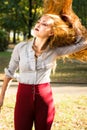 Girl swinging hair in the park