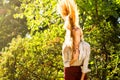 Girl swinging hair in the park