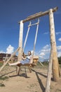 Girl swinging on wooden the seesaw