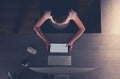 Girl with a Tablet and Headphones Studying at her Desk Royalty Free Stock Photo