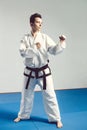 Girl, Taekwondo is martial Stoke hands in fists, focused, serious look in the Studio on gray isolated background Royalty Free Stock Photo