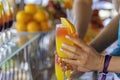 Girl take a glass with natural juice from the bar near the pool. Summer luxury tropical restaurant. Elegant cocktails Royalty Free Stock Photo