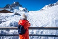 The girl take a photo pf Jade dragon Snow Mountain in Lijiang, Yunnan, China