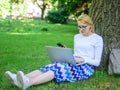 Girl takes advantage of online freelance job. Girl sit grass with notebook. Save your time with shopping online. Sales Royalty Free Stock Photo