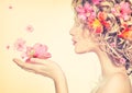 Girl takes beautiful flowers in her hands Royalty Free Stock Photo