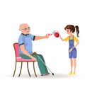 Girl takes care of grandfather, granddaughter bears senior gray-haired man sitting in wheelchair cup of tee Royalty Free Stock Photo