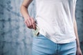 The girl takes money out of her pocket Royalty Free Stock Photo