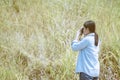 Girl takes photographs with vintage photo camera outdoor,Woman p Royalty Free Stock Photo