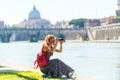 Girl takes a picture on the background of St. Peter's Cathedral Royalty Free Stock Photo